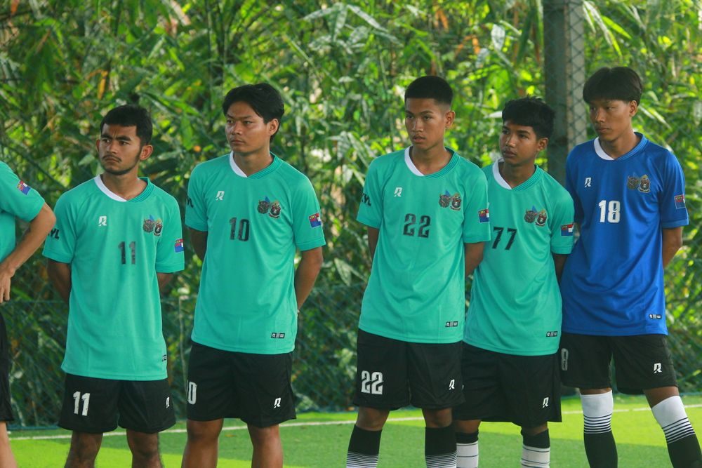 Football team lined up in matching numbered kits